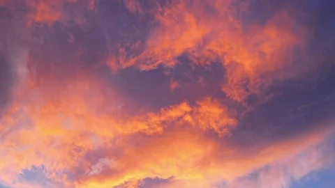Time-lapse of orange and black clouds, sky at sunset Stock Footage 128806838