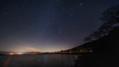 A time-lapse of Orion moving over Bassenthwaite lake in the English Lake Dist Stock Footage 168000616