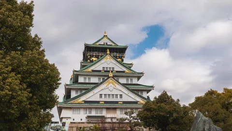 Time-lapse of Osaka Castle with drifting clouds in the daytime sky Stock Footage 310951010