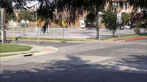 Time lapse outside school parking lot 32x Stock Footage 76545285