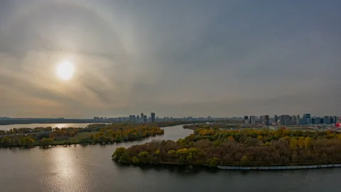 Time-lapse over the city river with boats passing through. Autumn trees Stock Footage 196637992