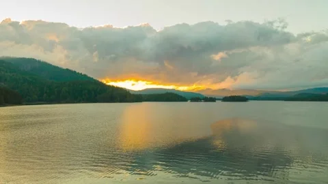 Time Lapse Over Lake With Sunset And Clouds In Background Stock Footage 249904760