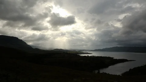 Time Lapse Over Scottish Landscape As Sunbeams Move Across Mountains And Loch Stock-Footage 125143580