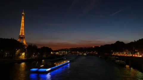 Time lapse over the Seine River, Paris, France, at sundown. Video stock 121287756
