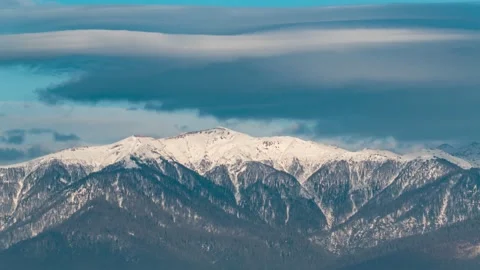 Time-lapse of overcast sky against the background of mountains, clouds fly Stock Footage 229526936