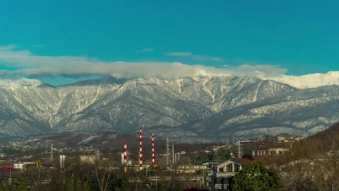 Time-lapse of overcast sky against the background of mountains, clouds fly 動画素材 229526945