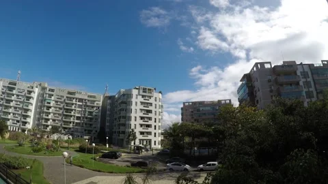 Time lapse overlooking buildings with sky in the background and moving clouds. Stock Footage 132734339