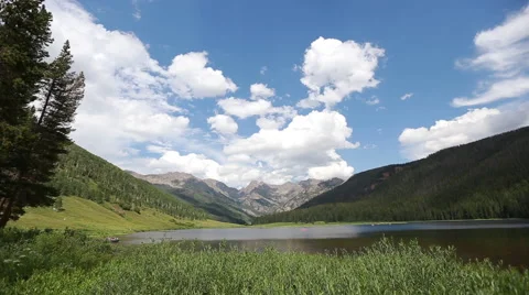 Time lapse of paddle boards and boats in epic mountains Stock Footage 40734965