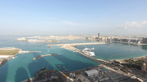 Time Lapse Pan across Dubai Eye and Palm Jumeira Vídeo Stock 102264604