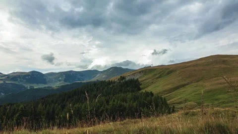 Time lapse with pan motion of clouds and misty fog in mountain environment Stock Footage 247471439