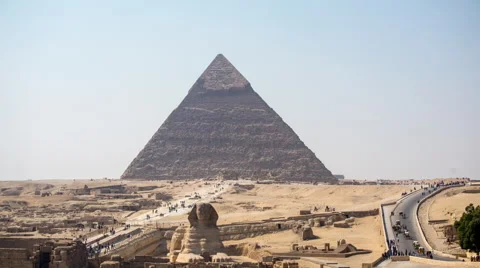 Time Lapse of Pan of the Sphinx &amp; Great Pyramids at Giza - Egypt Stock Footage 58911364
