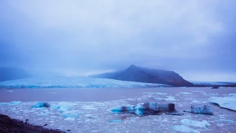 Time Lapse - Panning view of the glacier with cloudscape Stock Footage 72749883
