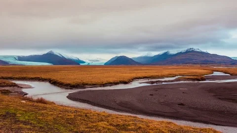 Time Lapse - Panning View of Running Rivers with Snowcapped Mountains Stock Footage 70574250