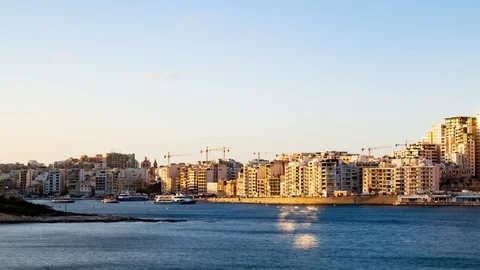 Time lapse panning view of Sliema seen from Villetta, Malta at sunset Stock Footage 108730129