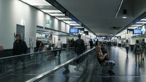 Time lapse panorama. Passengers walking at airport terminal. 4K. Video stock 98678402