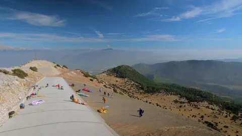 Time lapse: paragliders checking gear at Babadag summit, Turkey - timelapse Stock Footage 306493432