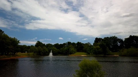 Time lapse in a park on a cloudy and windy day Stock Footage 108874943