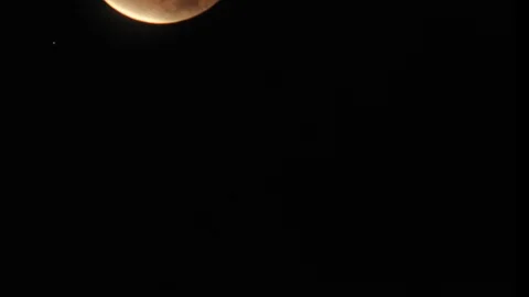 Time lapse of a partial lunar eclipse that occurred on December 10, 2010 in Oak Stock Footage 107559675