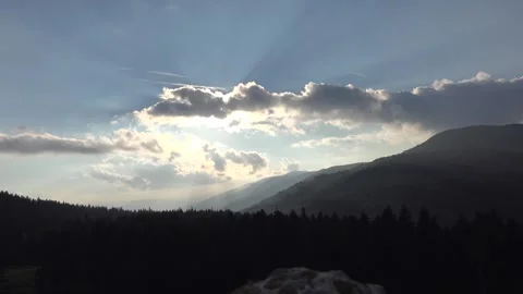 Time lapse partly cloudy sky over forested Cascade Range Mountains in the Stock Footage 339557712