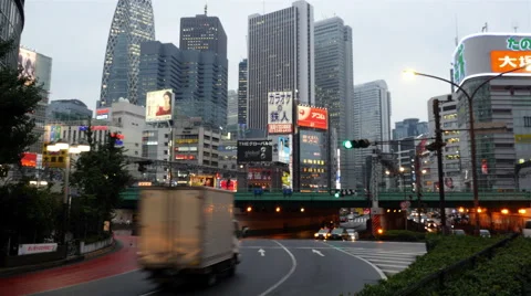 Time Lapse - Passenger Train with Busy Street Traffic in Shinjuku - Tokyo Japan Stock Footage 46467149