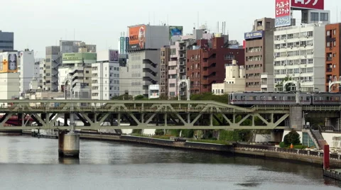 Time Lapse of Passenger Train Passing the Tokyo Skyline Daytime - Tokyo Japan Video stock 46459040