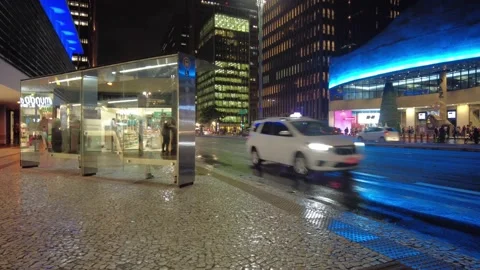 Time Lapse of Passengers board a bus, in Paulista Avenue at night Stock Footage 147308509