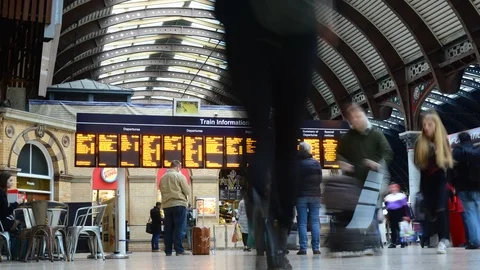 Time lapse passengers looking at departure and arrivals board at station Stock Footage 103251171