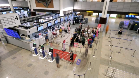 Time-lapse of passengers queueing to check-in counters at busy Bangkok airport Stock Footage 326389190