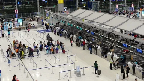 Time lapse of passengers wait at the check in queue in departure terminal Stock Footage 98088180