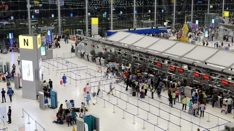 Time lapse of passengers wait at the check in queue in departure terminal Stock Footage 98088371