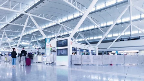 Time lapse of Passengers walking around in international airport Stock Footage 75712115