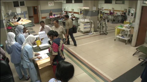 Time-lapse patients and nurses in busy Jakarta hospital ward Stock Footage