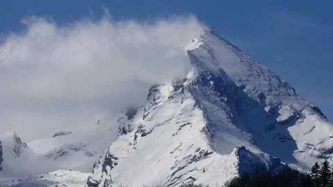 Time lapse of peak of Watzmann with clouds and many mountain climbers ascending Stock Footage 153499214