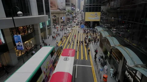 Time Lapse of pedestrians and buses in downtown Hong Kong Stock Footage 45135589
