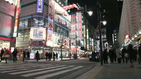 Time-lapse: Pedestrians walking and shopping at Shimbashi district at night Stock Footage 152125736