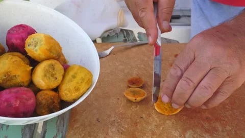 Time lapse peel prickly pears. With a knife, the outer layer of the prickly p Stock-Footage 146510216