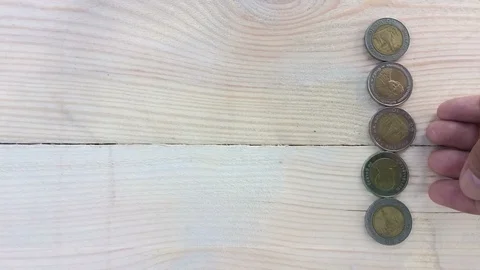 Time lapse people are counting coin money thai baht on wooden table 動画素材 98281961