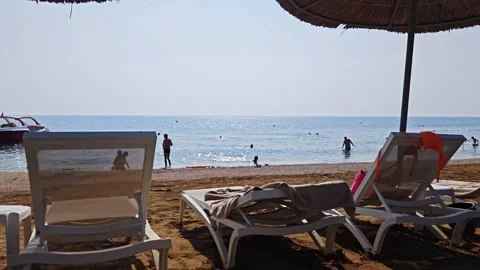 Time lapse. People on the beach. A Turkish beach on the Mediterranean Sea. Stock Footage 312936397