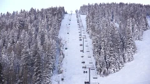 Time-lapse of people being conveyed up ski mountain. Stock Footage 18134801