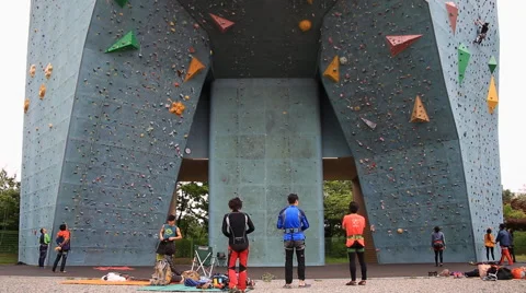 Time lapse of people climbing on artificial outdoor climbing wall Stock Footage 62858201