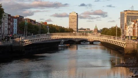 Time lapse of people crossing the Ha'penny Bridge in Dublin, Ireland, looking Stock Footage 320234405