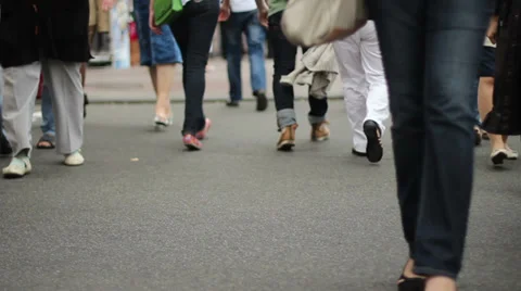 Time-lapse people crossing road after cars drive by, feet only Stock Footage