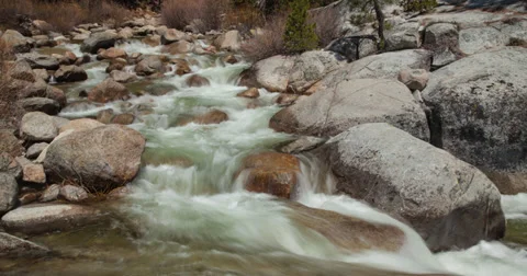 Time-Lapse of People Crossing a Stream of Water Stock Footage 37810375