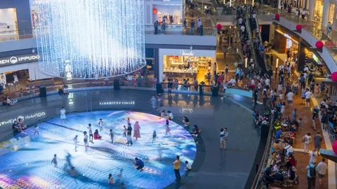 Time lapse of People inside the Marina Bay Sands Shoppes mall in Singapore Stock Footage 124894545