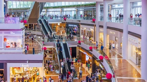Time lapse of People inside the Marina Bay Sands Shoppes mall in Singapore Stock Footage 124894972