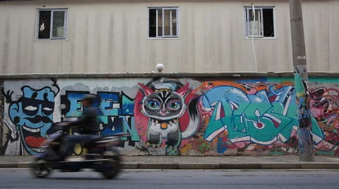 Time lapse of people passing by the wall with graffiti around Moganshan road Video stock 56805949