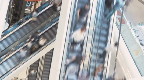 Time Lapse of people riding escalators in a shopping mall Stock Footage 66254658