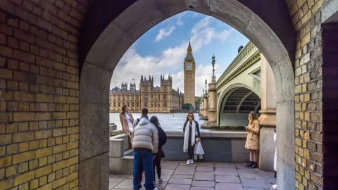 Time lapse of people by River Thames, Houses of Parliament, London, England Stock Footage 288466197