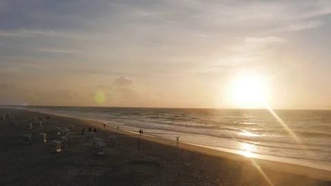 Time lapse of people walking on beach during sunset Stock Footage 71566430