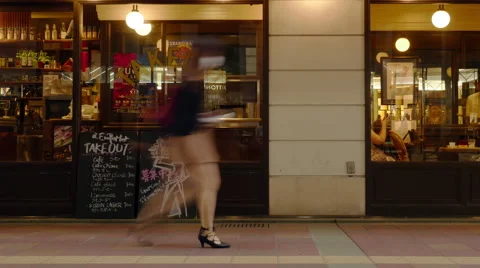 Time-lapse of people walking in front of french cafe Stock Footage 67976280